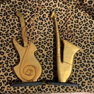 Set of musical instrument statues, black and gold.
